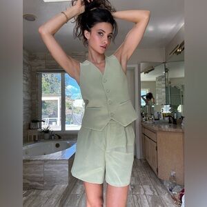 matching matcha green vest and shorts set by skies are blue